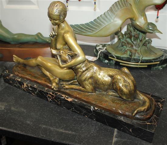 A French Art Deco bronze of a seated nude and dog, 28.5in.